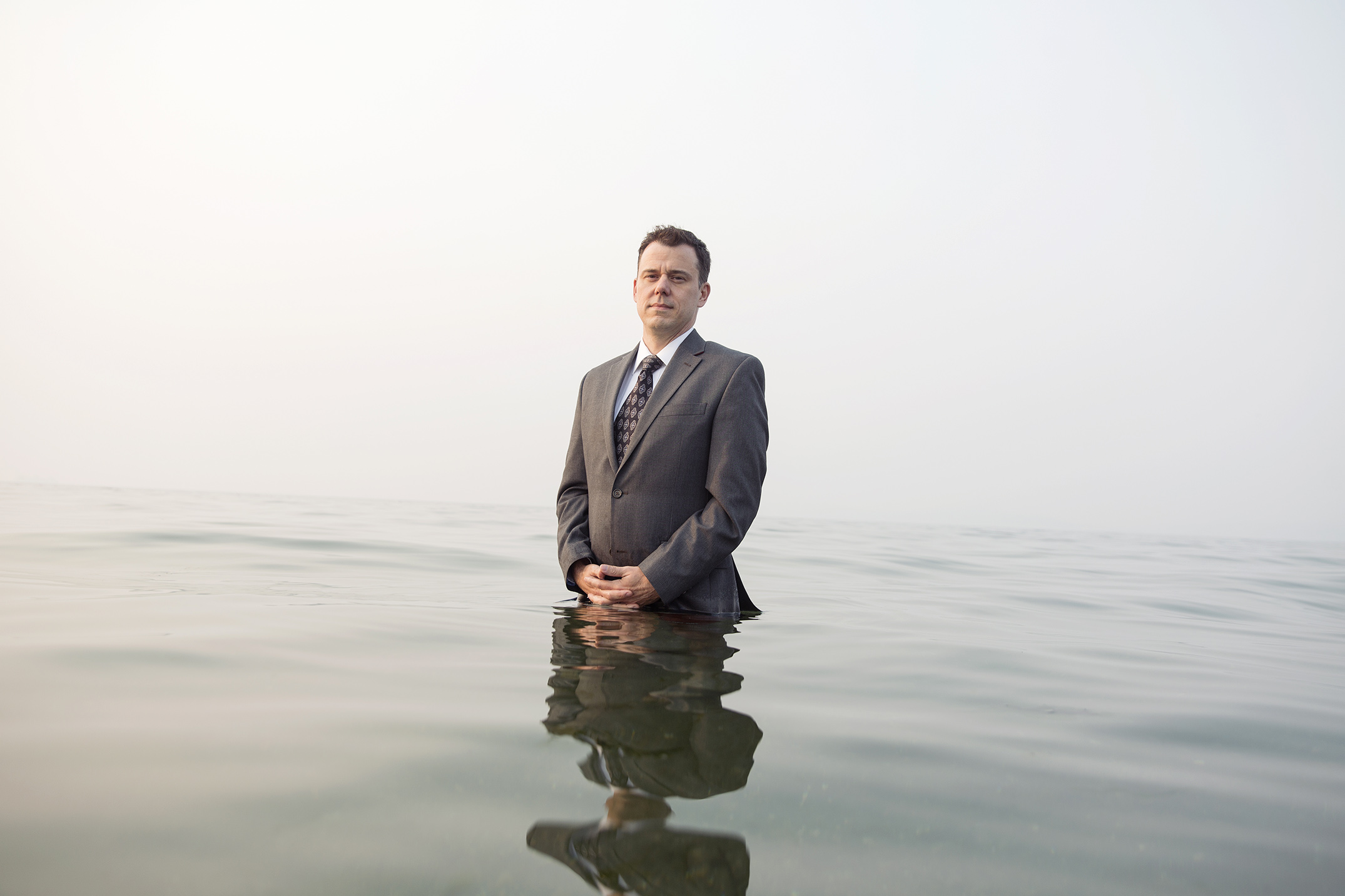 Mike Kane | Funeral director half-submerged in Puget Sound | Seattle documentary, editorial, and commercial photography